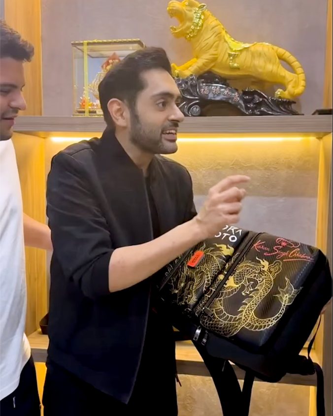 Karan Singh Chhabra with his custom Tora Moto dragon bag